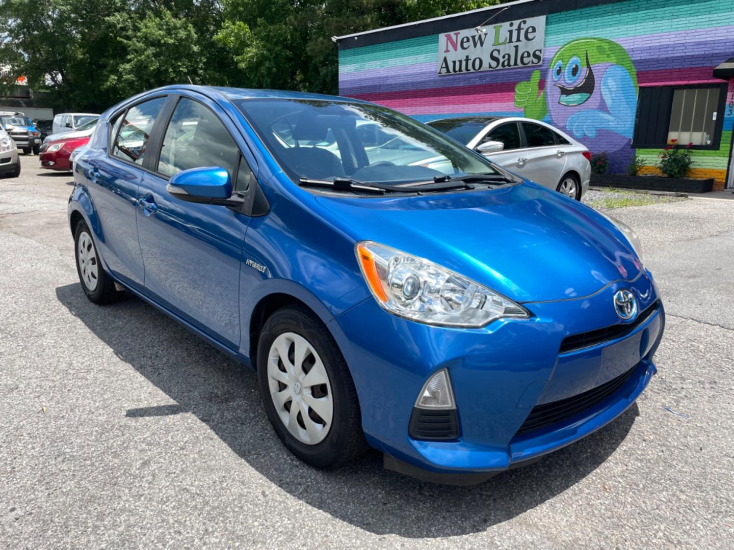 2013 BLUE TOYOTA PRIUS C ONE (JTDKDTB34D1) with an 1.5L engine, Continuously Variable transmission, located at 5103 Dorchester Rd., Charleston, SC, 29418-5607, (843) 767-1122, 36.245171, -115.228050 - Photo#0